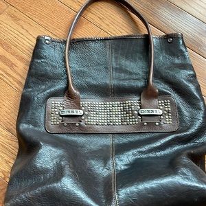 Beautiful Diesel bag  full leather and metal design.